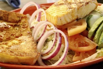 Mixed lettuce tossed in Balsamic vinagrette with sliced Tomatoes, Cucumber, Red Onions, Blue cheese crumbles, and sliced Avocado, with your choice of protein: Chicken breast, New York steak, or Salmon.